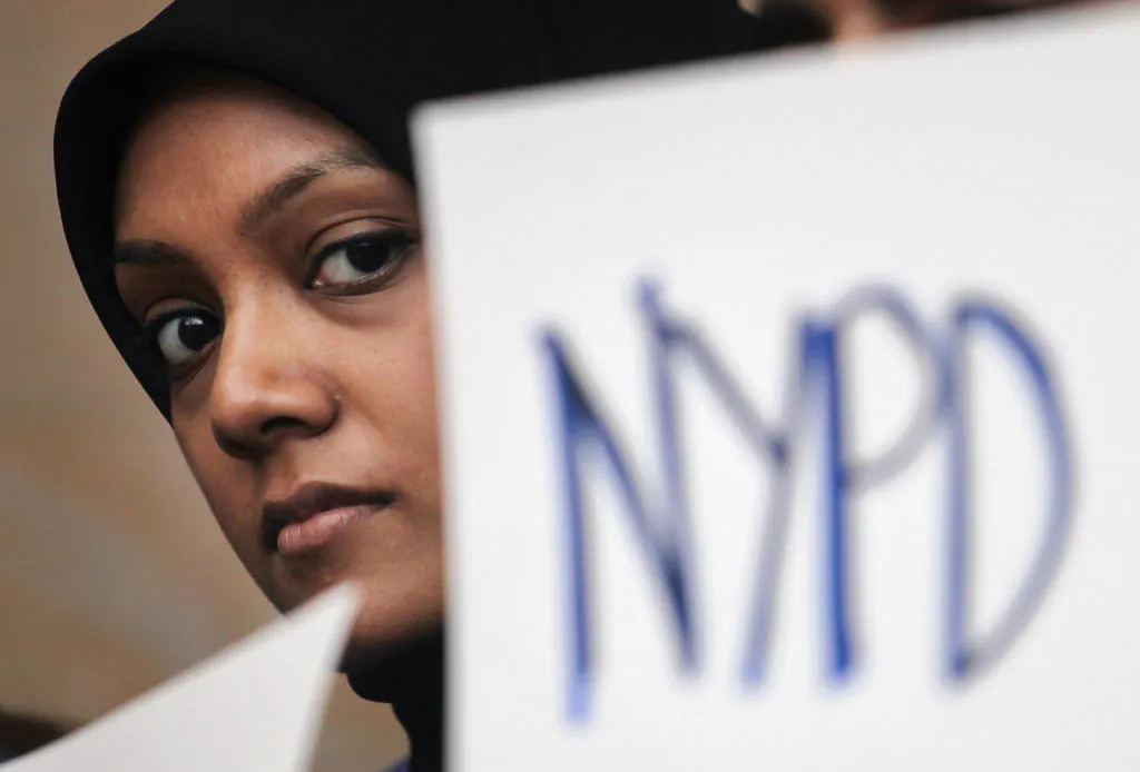 A New York University (NYU) student attends a town hall to discuss the NYPD's surveillance of Muslim communities on February 29, 2012 in New York City. The Justice Department is beginning a review on a possible investigation of civil rights violations due to the surveillance, which allegedly included NYU students. (Mario Tama/Getty Images)