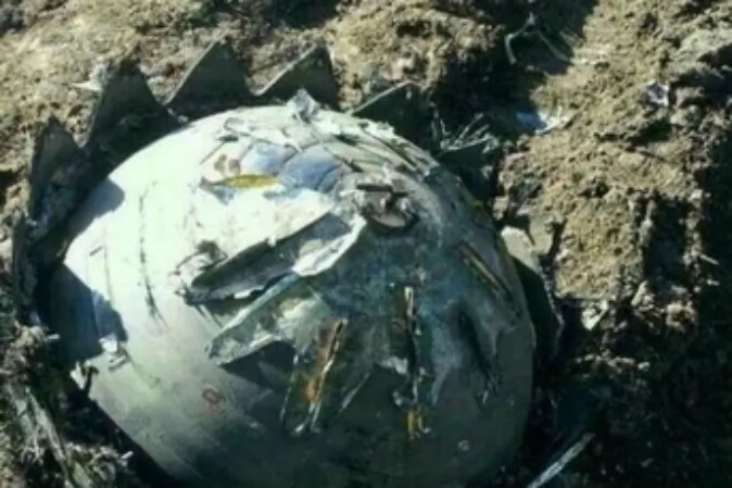 One of eight objects that fell from the sky in northeastern China May 16 and 17, 2014. (Network Screenshot)