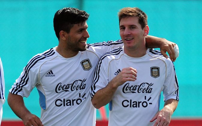 Argentina's national football forward Lionel Messi (R) talks with teammate forward Sergio Aguero during a training session in Ezeiza, Buenos Aires, on September 6, 2013. Argentina will face Paraguay on September 10 in Asuncion in a Brazil 2014 FIFA World Cup South American qualifier match. (DANIEL GARCIA/AFP/Getty Images)
