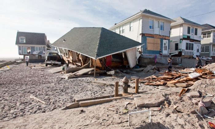 A House that is barely standing just a week after Hurricane Sandy ripped through the area in the Rockaways, New York, on Nov. 11, 2012. To this day, many people are still waiting for their houses to be re-built from the storm. (Samira Bouaou/Epoch Times)