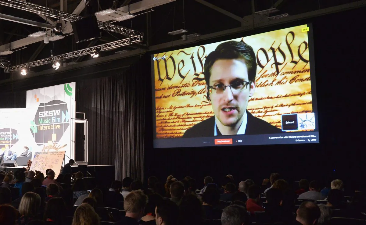 Edward Snowden, a former National Security Agency (NSA) contractor, speaks via videoconference during the 2014 SXSW Music Festival in Austin, Texas, last March. Hacking against American companies has increased fivefold since Snowden’s leaks last year. (AP Photo/NBC News)