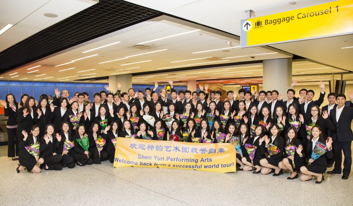 Part of Shen Yun International Company poses for a group photo at the John F. Kennedy International Airport on May 11, 2014. (Edward Dai/Epoch Times)