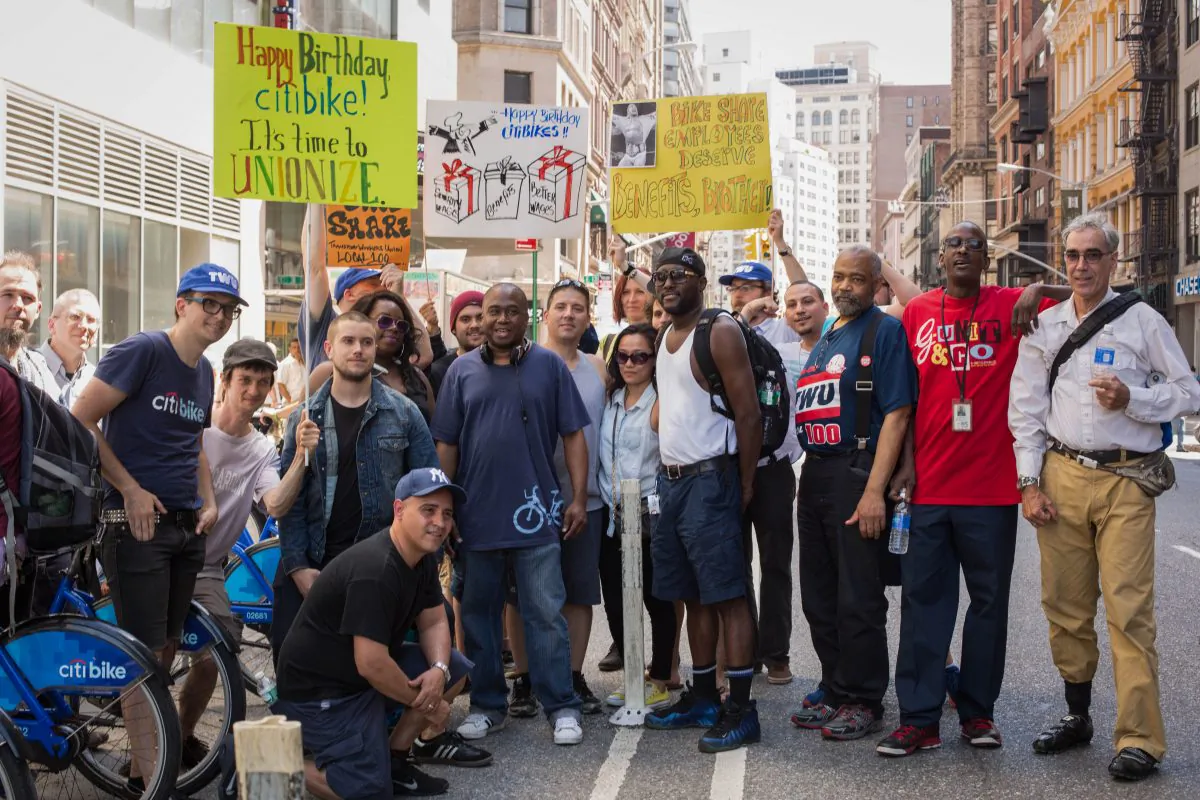 A crowd of Citi Bike workers rally at one of the docking stations in support of joining the Transportation Workers Union Local 100 in Union Square, Manhattan, on May 26, 2014. (Laura Cooksey/Epoch Times)