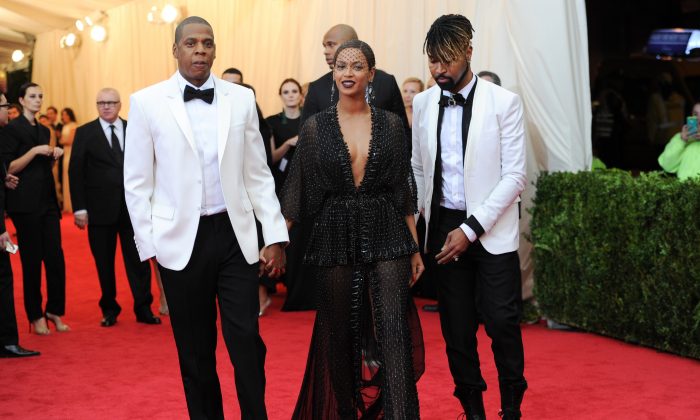Jay Z, left, and Beyonce arrive at The Metropolitan Museum of Art’s Costume Institute benefit gala celebrating “Charles James: Beyond Fashion” in New York on Monday, May 5, 2014. (Evan Agostini/Invision/AP)