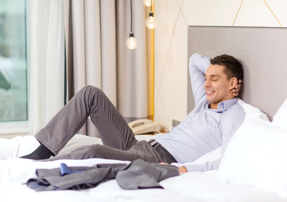 Stay in a well-known hotel chain that emphasizes in their marketing that they provide quality mattresses and bedding. (Syda Productions/Shutterstock)