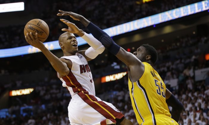 Miami Heat guard Ray Allen (34) drives to the basket over Indiana Pacers center Roy Hibbert (55) during the second half of Game 3 in the NBA basketball Eastern Conference finals playoff series, Saturday, May 24, 2014, in Miami. (AP Photo/Lynne Sladky)
