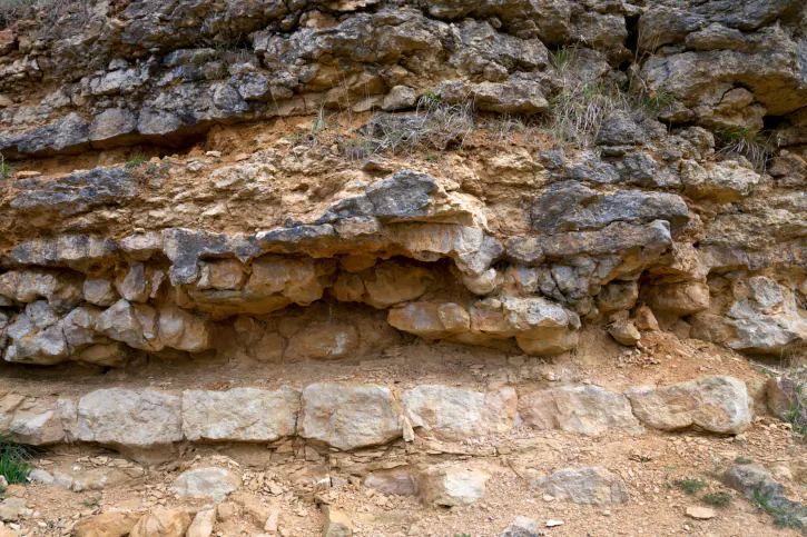 A file photo of a limestone rock formation. An 18th century discovery of man-made objects under layers of limestone is evidence, some say, that humans existed on earth hundreds of millions of years ago and even had an advanced civilization. 