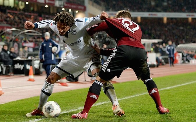 Jermaine Jones (L) of Schalke and Marvin Plattenhardt of Nuernberg compete for the ball during the Bundesliga match between 1. FC Nuernberg and FC Schalke 04 at Grundig Stadium on December 21, 2013 in Nuremberg, Germany. (Photo by Micha Will/Bongarts/Getty Images)