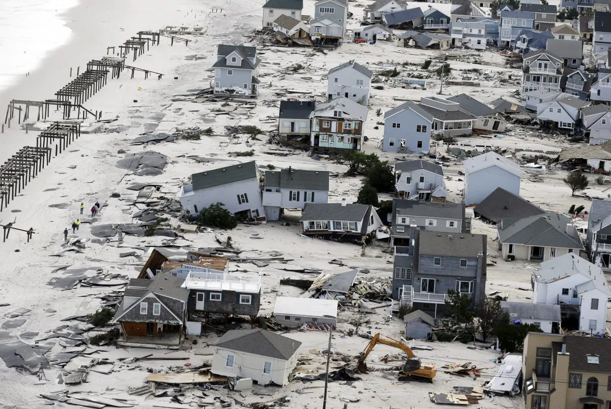 This Oct. 31, 2012, aerial photo shows destruction in the wake of Superstorm Sandy in Seaside Heights, N.J. (AP Photo/Mike Groll)
