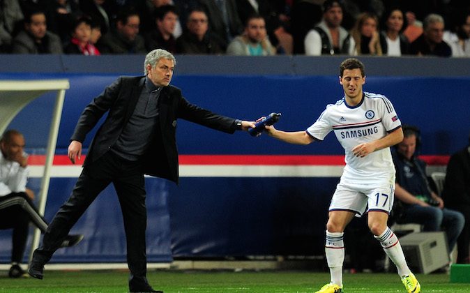 Jose Mourinho the Chelsea manager hands a water bottle to Eden Hazard of Chelsea during the UEFA Champions League quarter final, first leg match between Paris Saint Germain and Chelsea at Parc des Princes on April 2, 2014 in Paris, France. (Photo by Shaun Botterill/Getty Images)