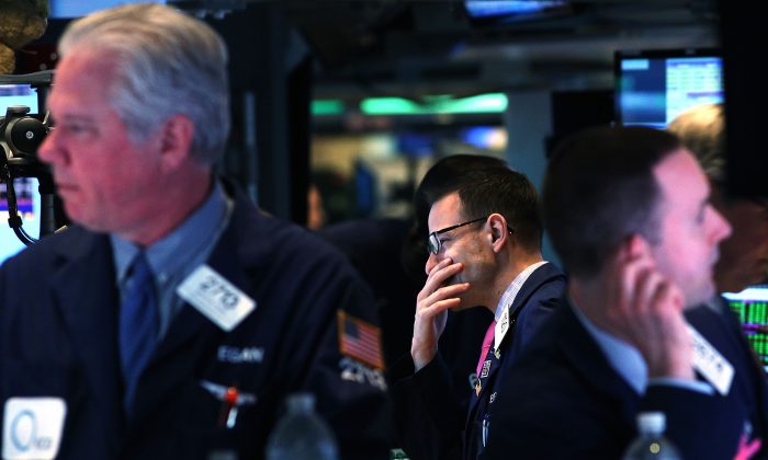 Traders work on the floor of the New York Stock Exchange. (Spencer Platt/Getty Images)