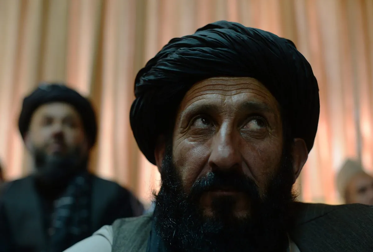 Supporters of Afghan presidential candidate Abdullah Abdullah listen to him speak during a press conference at his residence in Kabul on April 27, 2014. The two leading candidates in Afghanistan's presidential election raised allegations of ballot fraud on April 27, setting the stage for a difficult second-round vote likely to be targeted by Taliban militants. Shah Marai/AFP/Getty Images)