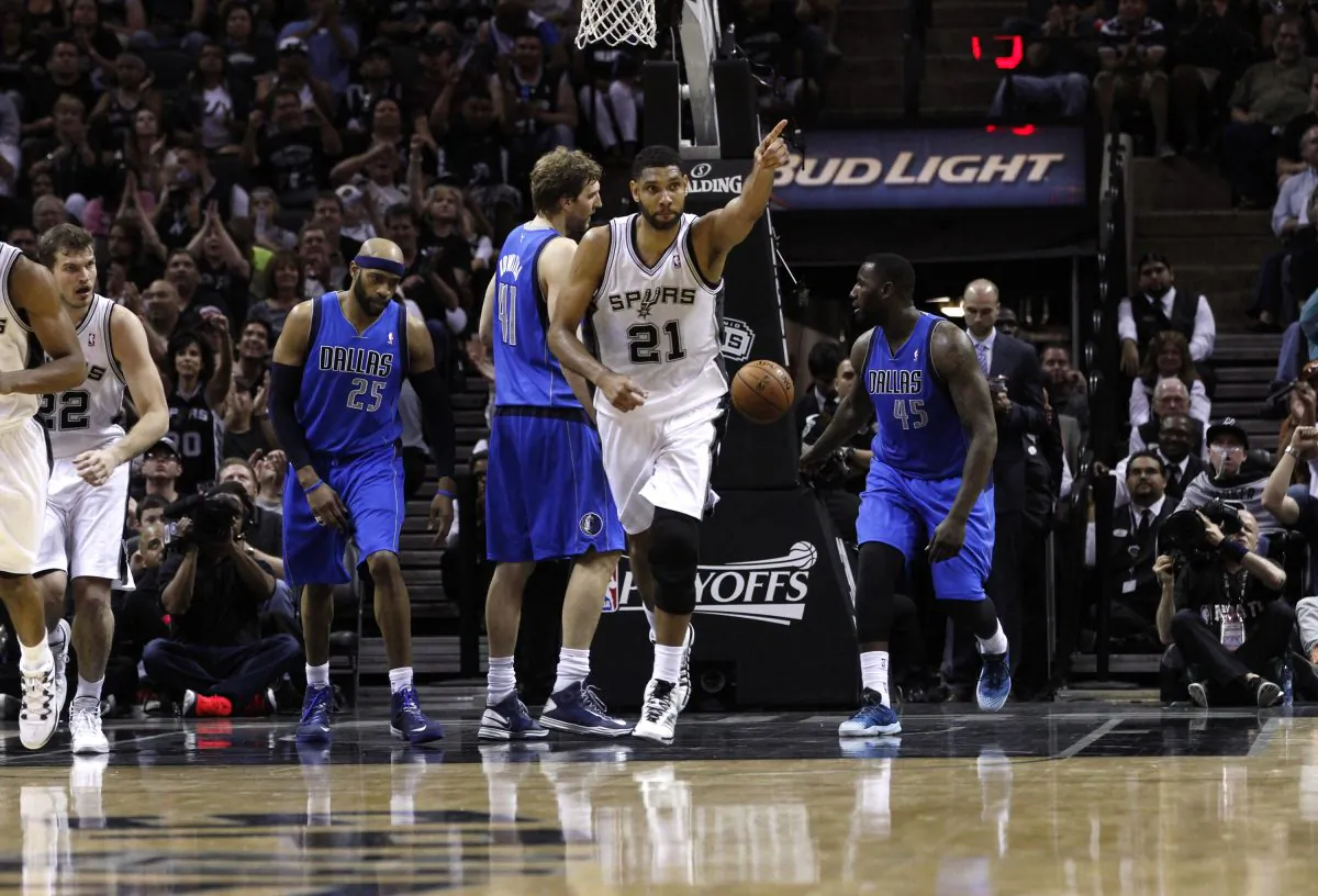 Tim Duncan #21 of the San Antonio Spurs reacts after scoring shoots against the Dallas Mavericks in Game Seven of the Western Conference Quarterfinals during the 2014 NBA Playoffs at the AT&T Center in San Antonio, Texas, on May 4, 2014. (Chris Covatta/Getty Images)