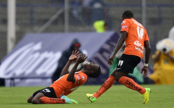 Enner Valencia (L) of Pachuca celebretes the third goal of the team against Pumas during their Mexican Clausura tournament quarterfinal football match on May 4, 2014 in Mexico City, Mexico. Pachuca won by 4-2. (OMAR TORRES/AFP/Getty Images)