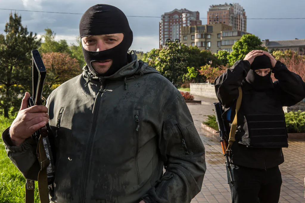 Pro-Russian activists pose for a picture outside the occupied regional administration building, which serves as their local headquarters, on May 8, 2014 in Donetsk, Ukraine. Tensions in Eastern Ukraine are high after pro-Russian activists seized control of at least ten cities ahead of the Victory Day holiday and a planned referendum on greater autonomy for the region. (Brendan Hoffman/Getty Images)