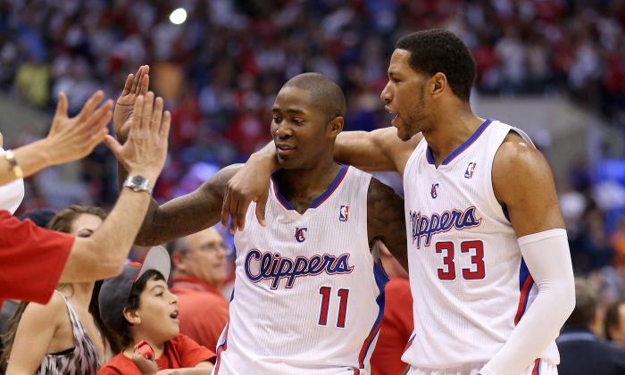 Jamal Crawford #11 and Danny Granger #33 of the Los Angeles Clippers celebrate the fans after defeating the Oklahoma City Thunder in Game Four of the Western Conference Semifinals during the 2014 NBA Playoffs at Staples Center on May 11, 2014 in Los Angeles, California. The Clippers won 101-99. (Stephen Dunn/Getty Images)