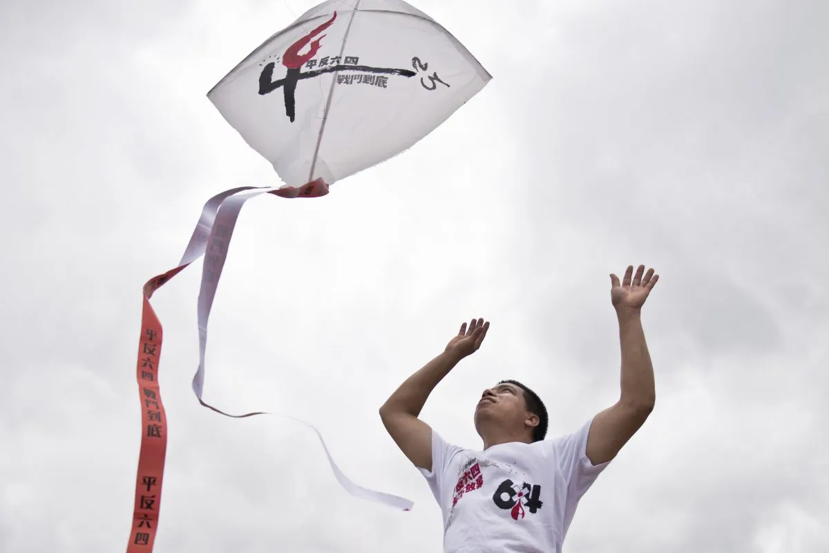 A pro-democracy activist releases a kite in Hong Kong on May 18, 2014 at an event to promote democratic movements in China and mark 25 years since the 1989 pro-democracy protests in Beijing's Tiananmen Square. Hundreds, perhaps thousands, are believed to have died when the Chinese government sent in tanks and soldiers to clear Tiananmen Square, bringing a violent end to six weeks of pro-democracy protests in early June 1989. (Alex Ogle/AFP/Getty Images)