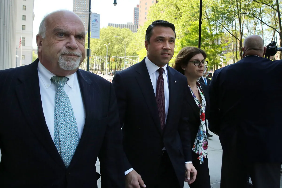 New York Rep. Michael Grimm (C) walks into a Brooklyn Federal Court hearing May 19, 2014, after an April indictment on 20 counts. (Spencer Platt/Getty Images)