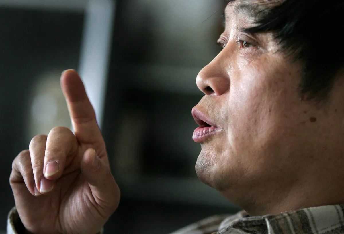 Xu Youyu, a philosophy professor at the Chinese Academy of Social Sciences and a former Red Guard, reflects on the Cultural Revolution from his home in Beijing, 28 April 2006. It was forty years ago on 16 May 1966 that Chairman Mao Zedong unleashed China's infamous Cultural Revolution, sparking a decade of terror and violence that continues to haunt both the country and its people as it unravelled into a disaster that claimed millions of lives and pushed China to the brink of economic and social collapse. "Mao told people that he wanted to realize a fair and equal society. He deceived people by saying that (inequality) was due to his enemies," said Xu, who blames the Cultural Revolution for causing invisible and irrecoverable internal injuries in people's minds. (Frederic J. Brown/AFP/Getty Images)