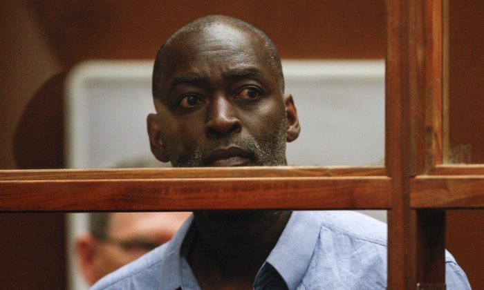 Actor Michael Jace appears in court in Los Angeles Thursday, May. 22, 2014.  A judge has delayed the arraignment of  Jace on a murder charge filed over his wife's shooting death earlier this week. Attorneys for Jace, who played a police officer in the hit TV series "The Shield," sought a continuance during the actor's first court appearance in Los Angeles on Thursday. He's due back in court June 18. The 51-year-old was charged Thursday with a single count of murder and he is accused of shooting his wife April multiple times in their home Monday evening. (AP Photo/David McNew, Pool)