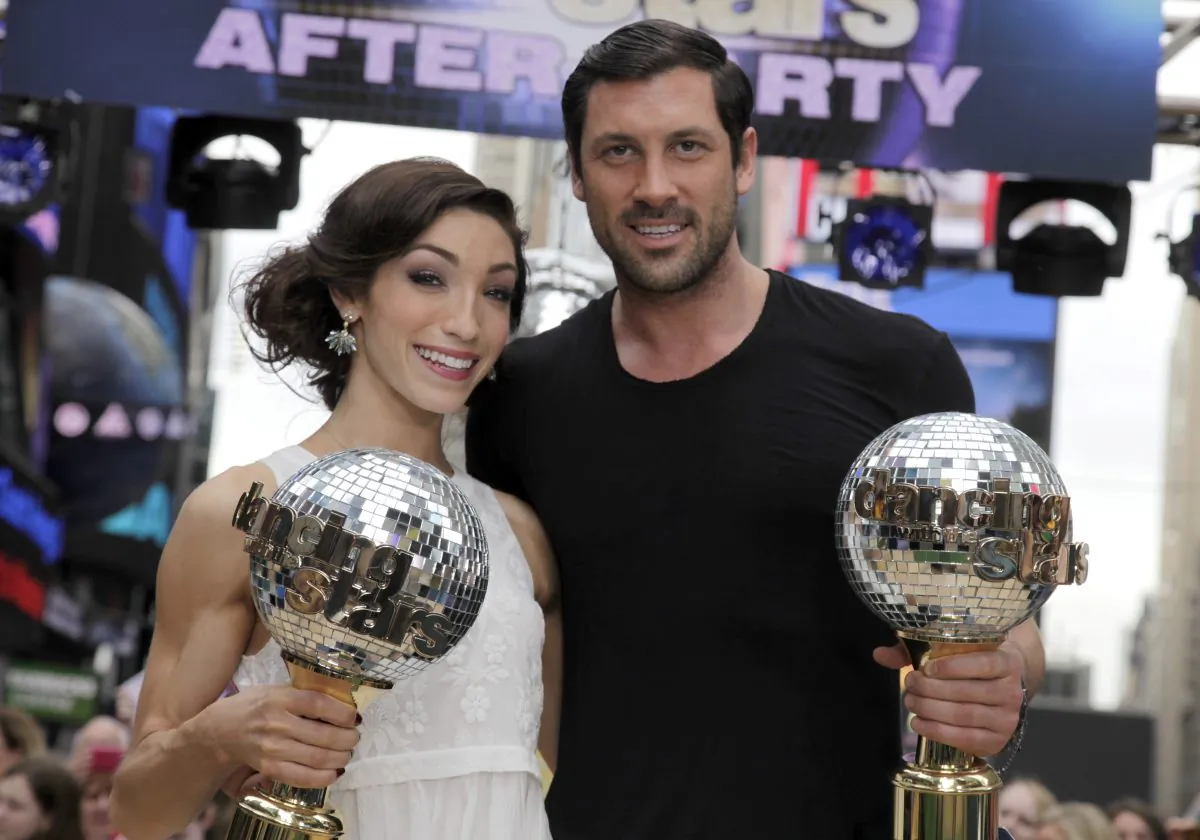 Olympic athlete Meryl Davis and dancer Maksim Chmerkovskiy, winners of "Dancing with the Stars" , appear on ABC's Good Morning America on Wednesday, May 21, 2014, in New York. (Andy Kropa/Invision/AP)