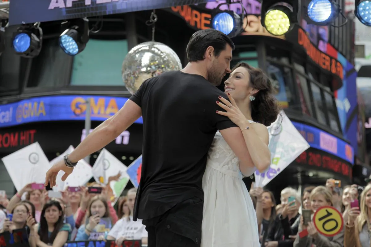 Olympic athlete Meryl Davis, right, and dancer Maksim Chmerkovskiy, winners of "Dancing with the Stars" , appear on ABC's Good Morning America on Wednesday, May 21, 2014, in New York. (Andy Kropa/Invision/AP)
