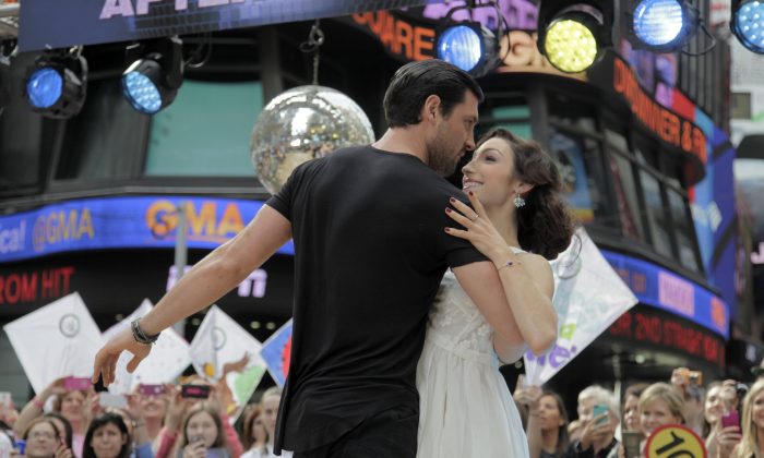 Olympic athlete Meryl Davis, right, and dancer Maksim Chmerkovskiy, winners of "Dancing with the Stars" , appear on ABC's Good Morning America on Wednesday, May 21, 2014, in New York. (Andy Kropa/Invision/AP)