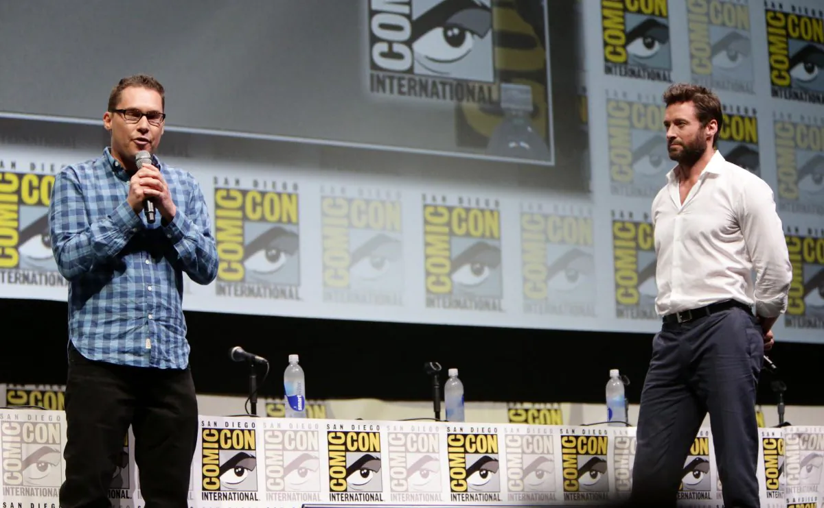 Director/Producer Bryan Singer and Hugh Jackman seen at the 20th Century Fox Presentation at 2013 Comic-Con, on Saturday, July, 20, 2013 in San Diego, Calif. (Photo by Eric Charbonneau/Invision for 20th Century Fox/AP Images)