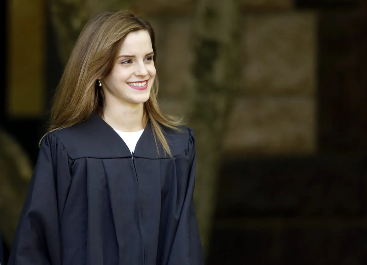 Actress Emma Watson walks between buildings following commencement services on the campus of Brown University, Sunday, May 25, 2014, in Providence, R.I. (AP Photo/Steven Senne)