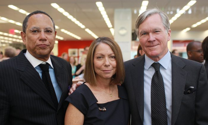 FILE - In this June 2, 2011 file photo released by The New York Times, managing editor Dean Baquet, executive editor Jill Abramson, center, and outgoing executive Bill Keller, pose for a photo at the newspapers New York office. The New York Times announced on Wednesday, May 14, 2014, that Abramson, the newspapers first female executive editor, is being replaced by Baquet after two and a half years on the job. (AP Photo/The New York Times, Fred R. Conrad) NO SALES