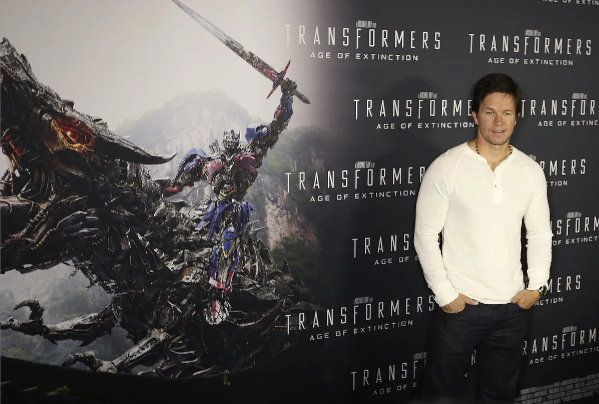 Actor Mark Wahlberg poses for a photo on the red carpet premier of his new movie Transformers; Age of Extinction in Sydney Australia Wednesday, May 21, 2014, (AP Photo/Rob Griffith)