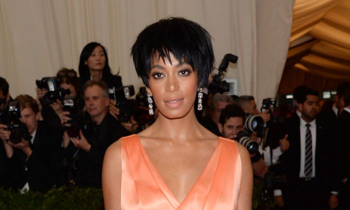 FILE - This May 5, 2014 file photo shows Solange Knowles, sister of Beyonce Knowles, at The Metropolitan Museum of Art's Costume Institute benefit gala celebrating "Charles James: Beyond Fashion" in New York. Beyonce, Jay Z and Solange say they have worked through and are moving on since a video leaked this week of Solange attacking Jay Z in an elevator inside the Standard Hotel after the May 5, gala. (Photo by Evan Agostini/Invision/AP)