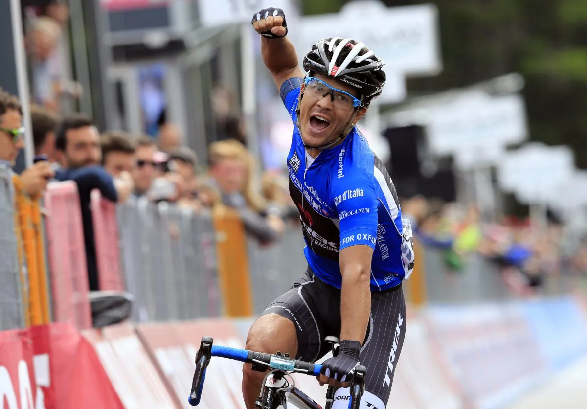 Colombian Julián Arredondo of Trek celebrates as he crosses the finish line of Stage 18 of the 97th Giro d'Italia, from Belluno to Rifugio Panarotta on May 29, 2014 in Rifugio Panarotta. (Luk Benies/AFP/Getty Images)