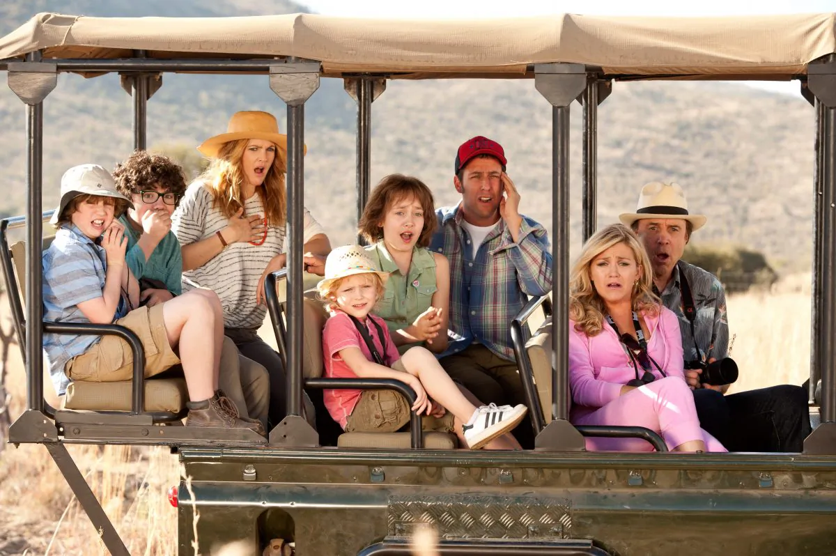 (L–R) Kyle Red Silverstein as Tyler, Braxton Beckham as Brendan, Drew Barrymore as Lauren, Alyvia Alyn Lind as Lou, Emma Fuhrmann as Espn, Adam Sandler as Jim, Jessica Lowe as Ginger, and Kevin Nealon as Eddy in “Blended.” (David Bloomer/Warner Bros.)