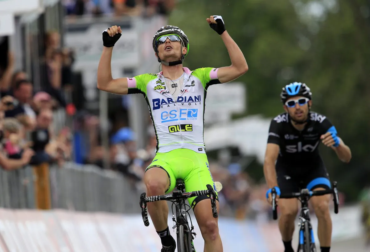Bardiani rider Enrico Battaglin celebrates his victory as he crosses the finish line of the Stage 14 of the 97th Giro d'Italia, 164 kme from Aglie to Oropa (Biella) on May 24, 2014 in Oropa. (Luk Benies/AFP/Getty Images)
