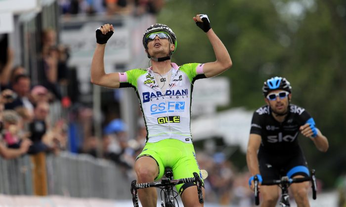 Bardiani rider Enrico Battaglin celebrates his victory as he crosses the finish line of the Stage 14 of the 97th Giro d'Italia, 164 kme from Aglie to Oropa (Biella) on May 24, 2014 in Oropa. (Luk Benies/AFP/Getty Images)