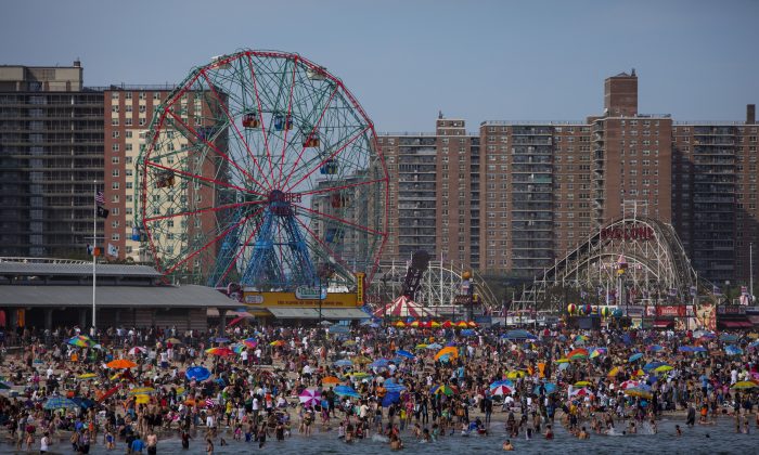 People crowd the beach at Coney Island on Memorial Day May 26, 2014 in the Brooklyn borough of New York City. Eric Thayer/Getty Images)