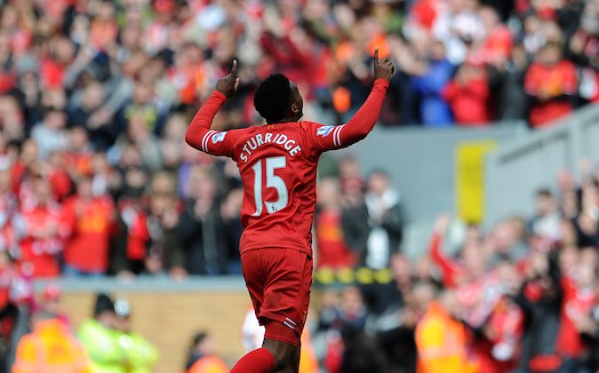 Liverpool's Daniel Sturridge celebrates after he scores the second goal of the game for his side during their English Premier League soccer match against Newcastle United at Anfield in Liverpool, England, Sunday May 11, 2014. (AP Photo/Clint Hughes)