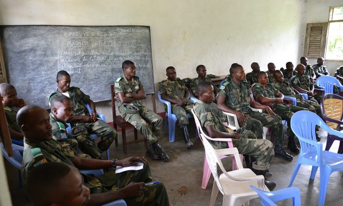 Some 30 soldiers and a few policemen attend a campaign against sexual violence, led by the UNHCR in northwestern Democratic Republic of Congo on Dec. 6, 2013. (Habibou Bangre/AFP/Getty Images)