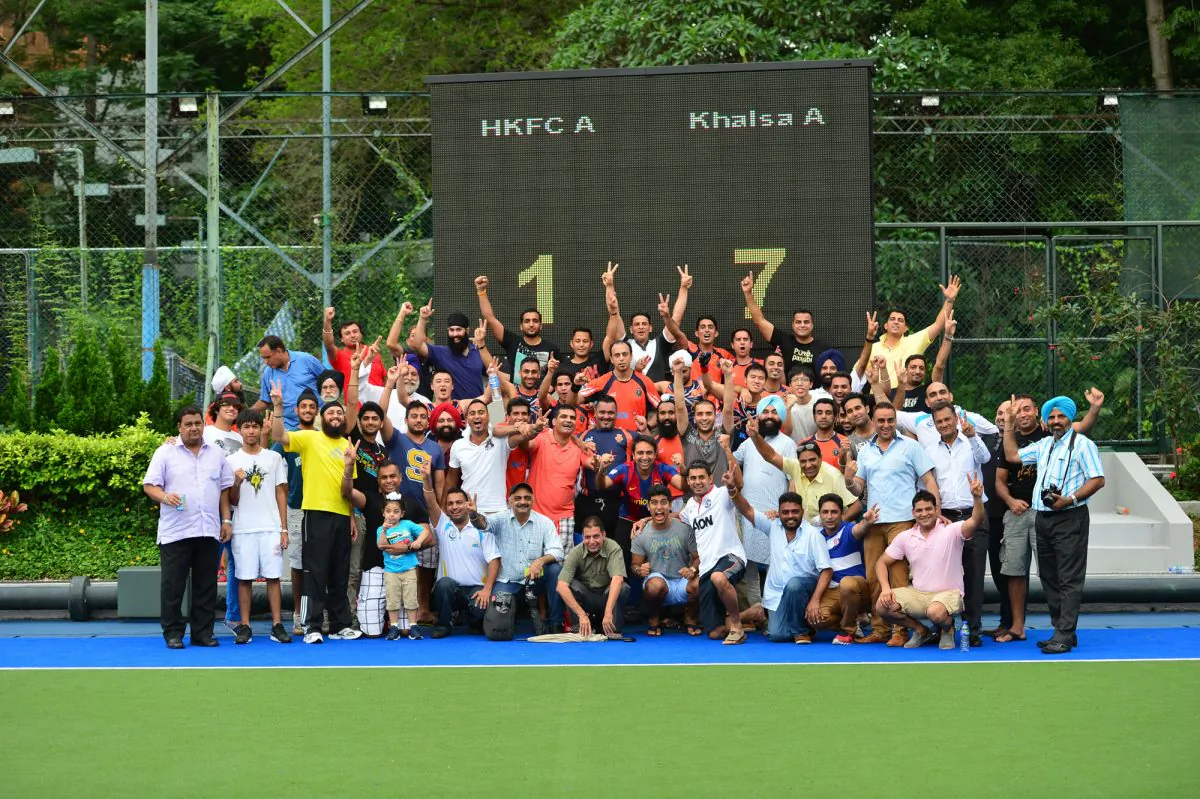 Khalsa players, officials and fans celebrate Khalsa's win in the 2013-14 Holland Cup at King's Park on Sunday May 11. (Eddie So)