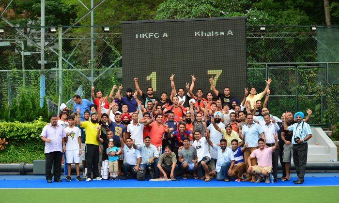 Khalsa players, officials and fans celebrate Khalsa's win in the 2013-14 Holland Cup at King's Park on Sunday May 11. (Eddie So)