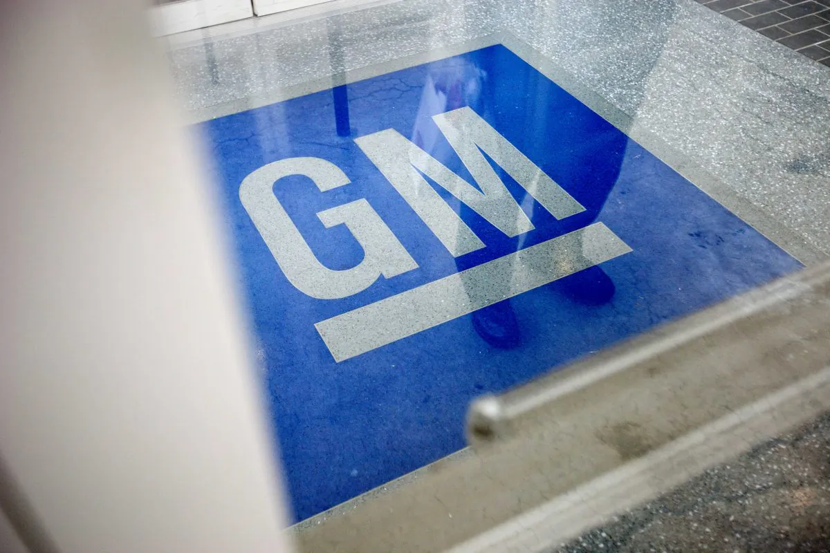 The General Motors' logo decorates the entrance at the site of a GM information technology center in Roswell, Ga., on Jan. 10, 2013. (AP Photo/David Goldman)