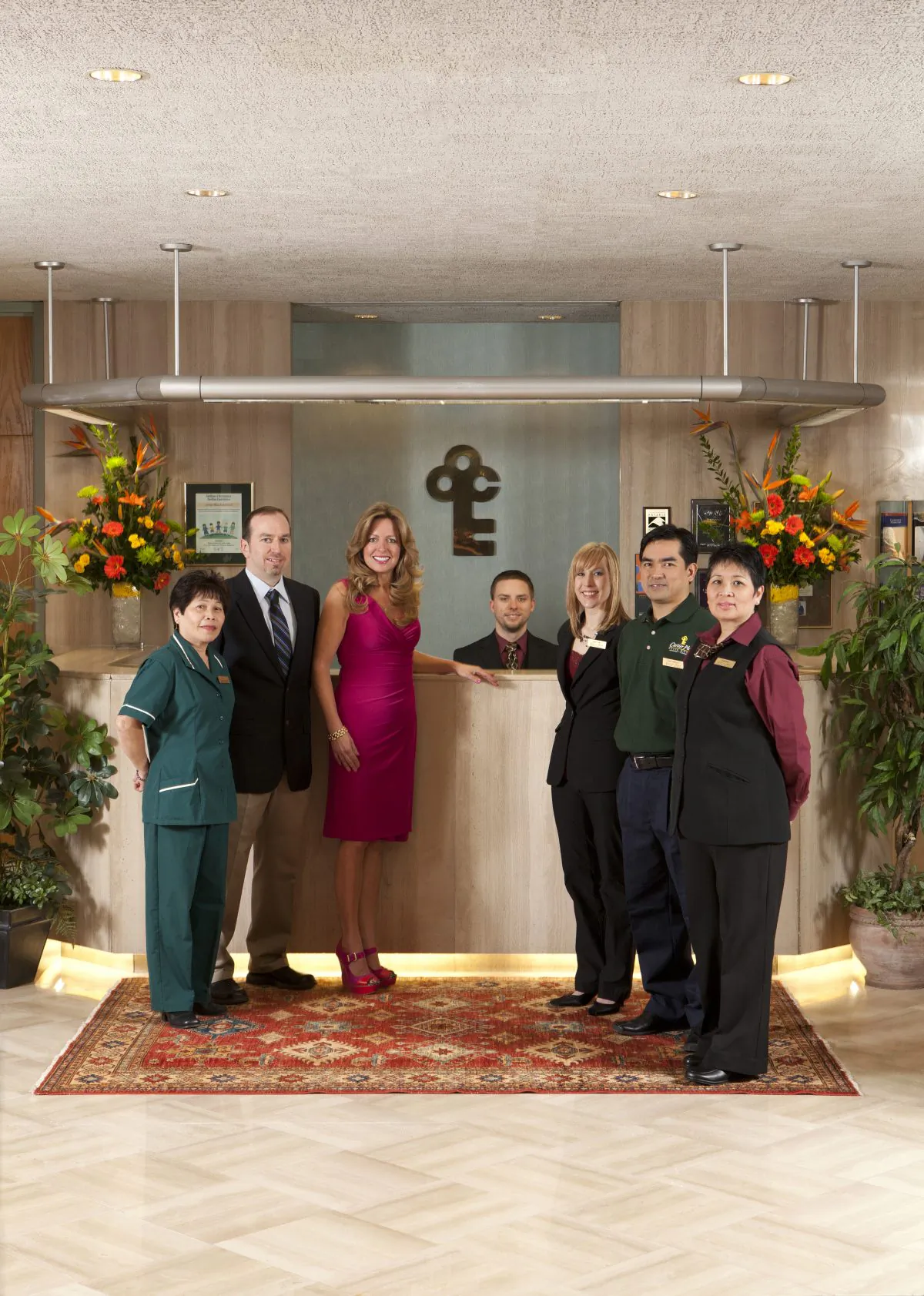 General Manager Heidi Webster (c) and her staff in the lobby of Cartier Place Suite Hotel. (John Major)