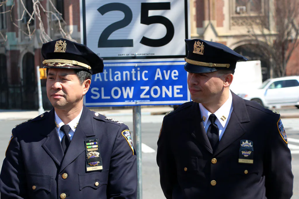 Police officers at a slow zone on Atlantic Ave from Brooklyn Heights to Woodhaven in Queensduring during a Vision Zero announcement, April 9. (Allen Xie/Epoch Times)