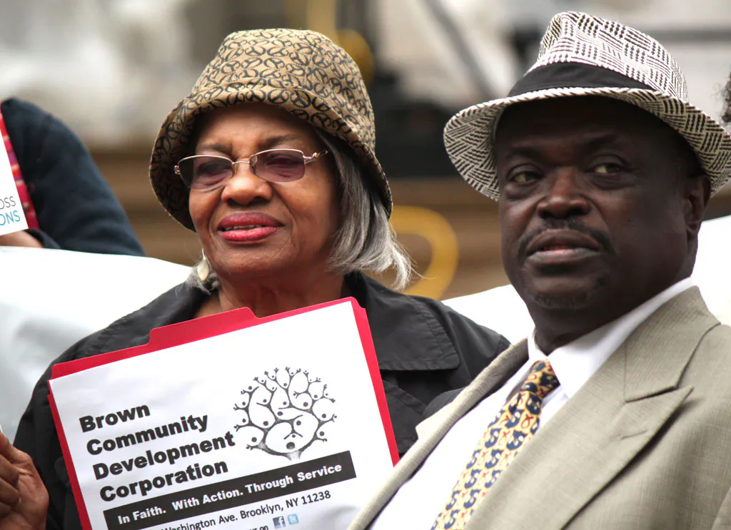 Keith Luke, 56, stands with another senior in front of City Hall, demanding an increase in funding for senior services in New York on Wednesday. (Venus Upadhayaya/Epoch Times)