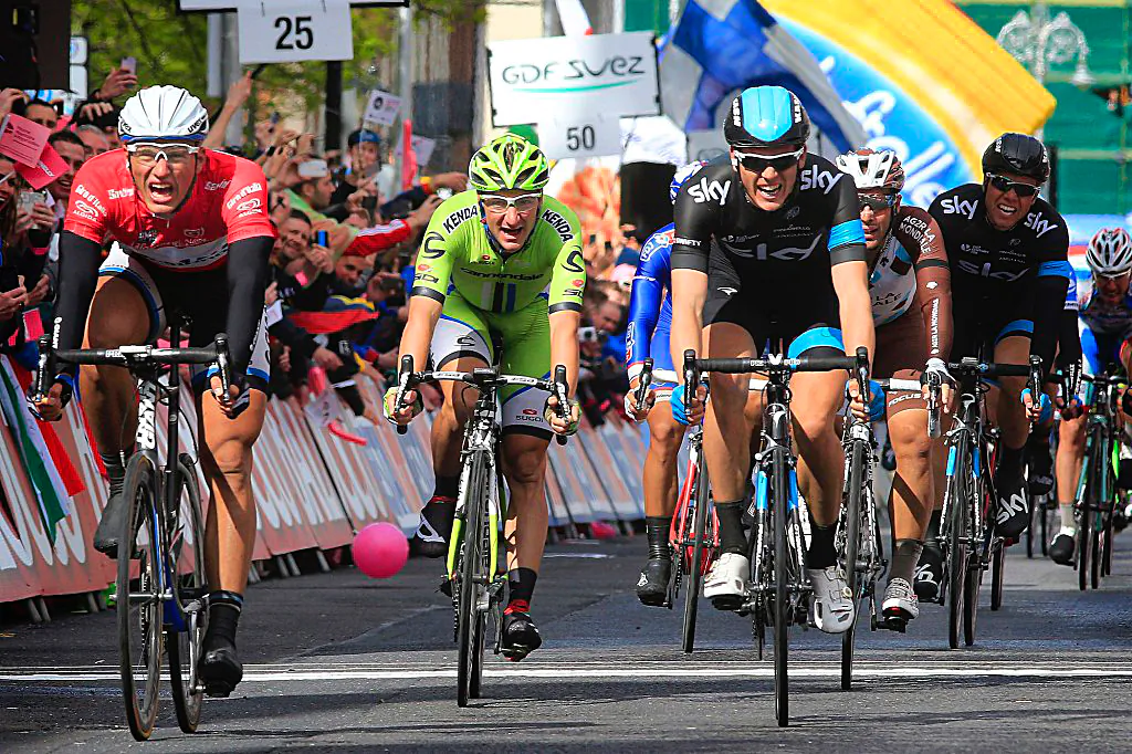 Marcel Kittel of Giant-Shimano (L) crosses the finish line a foot ahead of rival Ben Swift of Sky (3L) and Cannondale's Elia Viviani (2L.) (© Cor Vos/Team Giant-Shimano)