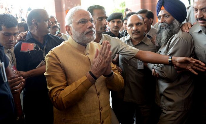 Indian Bharatiya Janata Party (BJP) leader Narendra Modi gestures as he arrives at the Parliament building in New Delhi on May 20, 2014. (Raveendran/AFP/Getty Images) 