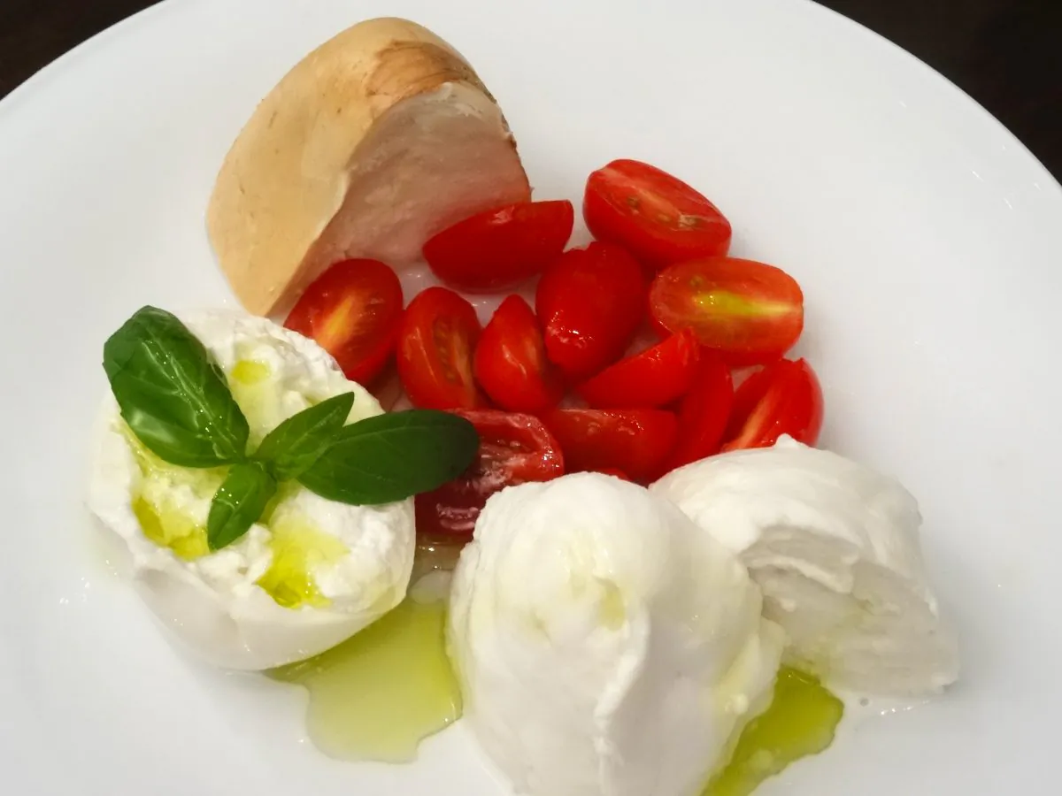 Burrata with cherry tomatoes. (Courtesy of Mozzarella & Vino)