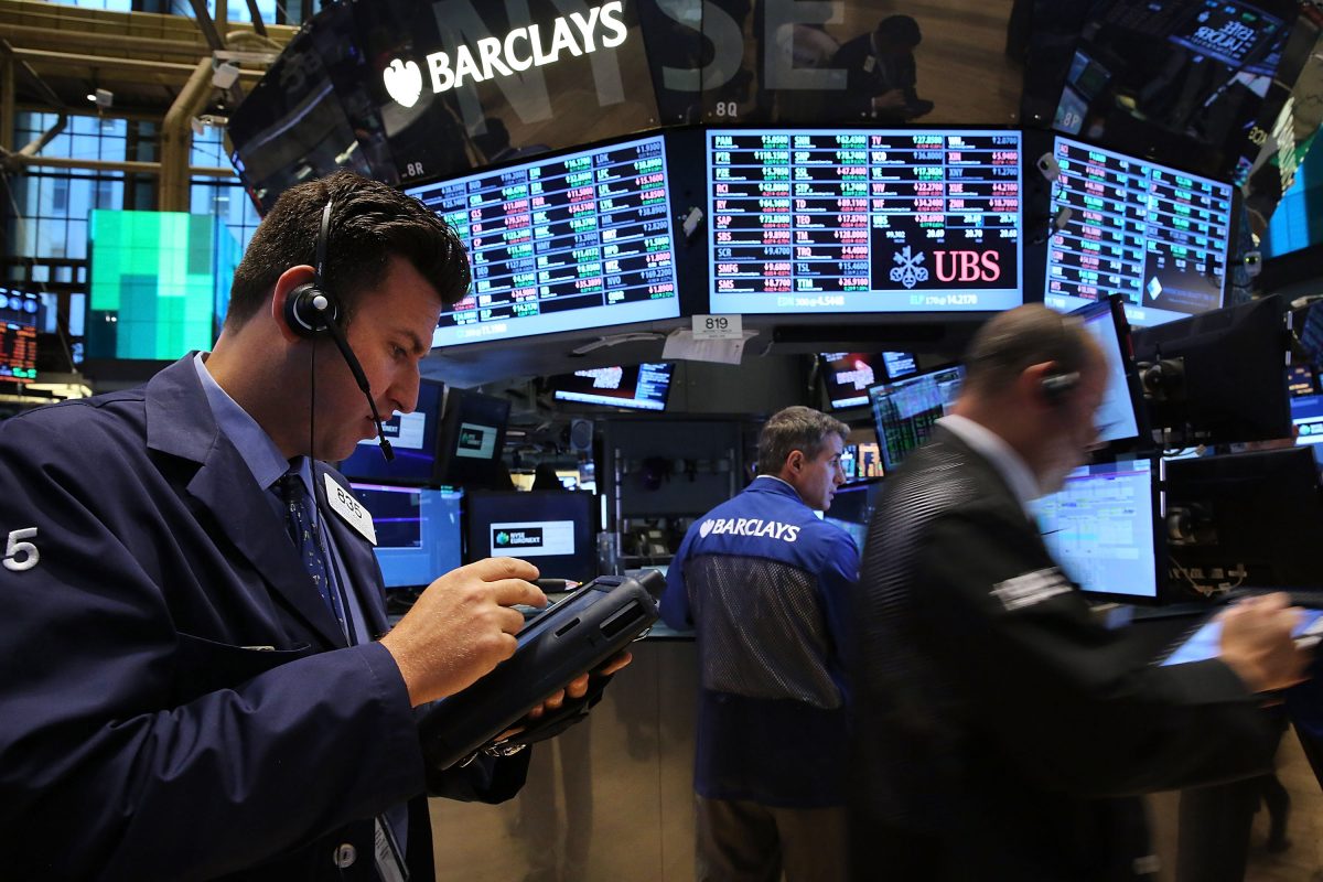 Stock traders work on the floor of the New York Stock Exchange on Oct. 1, 2013, in New York City. The new heights reached by stock markets in the U.S. in recent months have been tempting investors to use leverage to participate. (Spencer Platt/Getty Images)