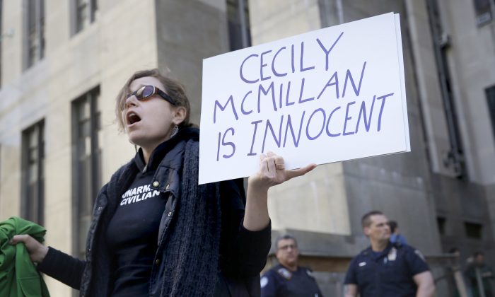 Sarah Wellington stands in front of the courthouse after the sentencing of Occupy Wall Street activist Cecily McMillan in Manhattan, on May 19, 2014. (Seth Wenig/AP)
